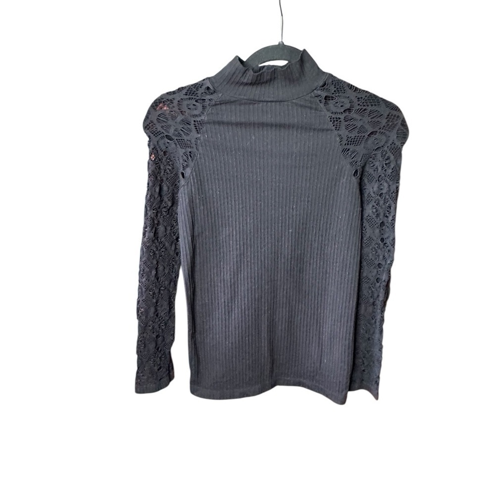 Nikibiki Bodycon Black ribbed mock neck with lace net sleeves .
